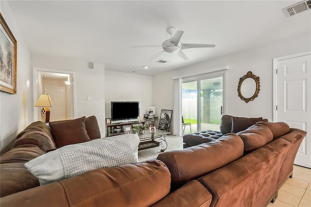 living room with light tile patterned floors and ceiling fan