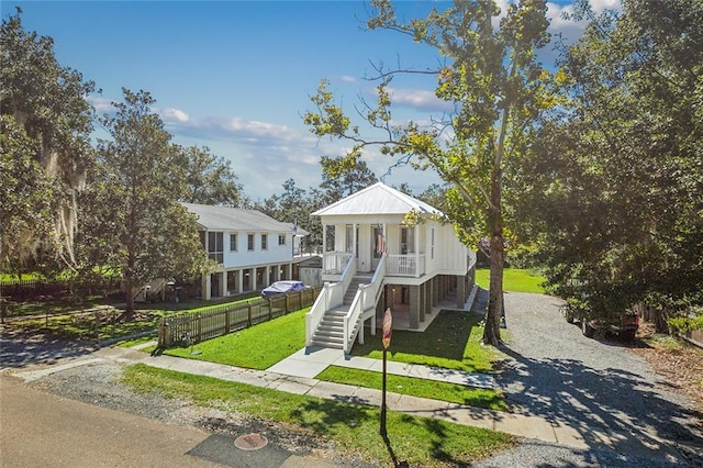 view of front of house with a front lawn and a porch