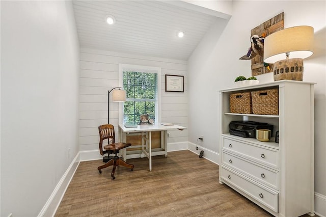 office area featuring hardwood / wood-style flooring and lofted ceiling