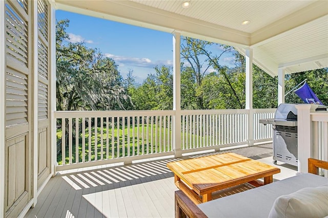 wooden deck featuring grilling area