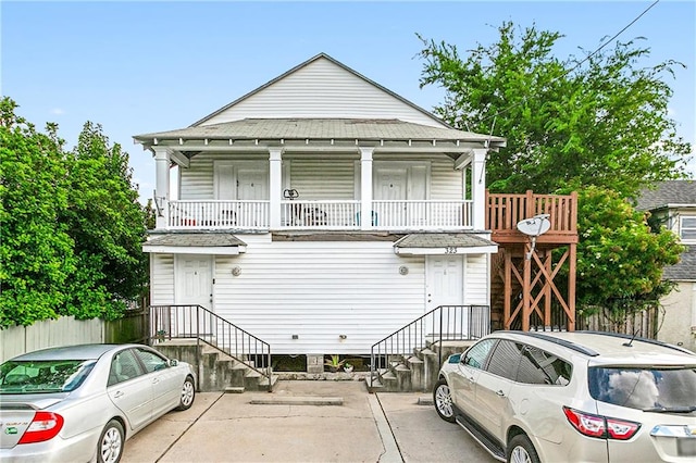 view of front of property with a balcony