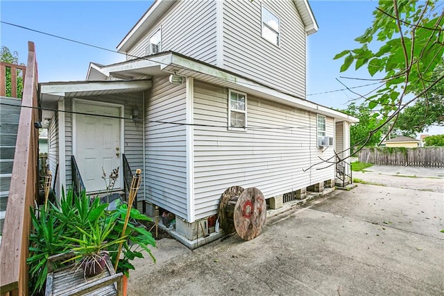 view of property exterior featuring a patio and cooling unit