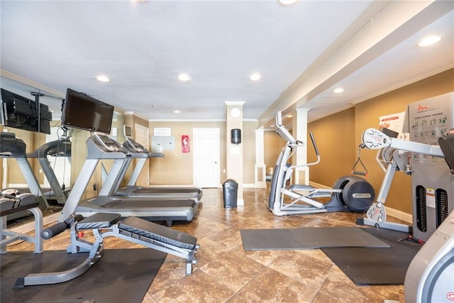 workout room featuring ornamental molding