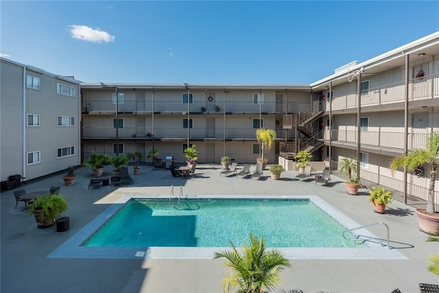 view of swimming pool featuring a patio area