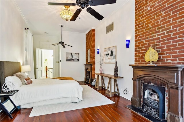 bedroom featuring ornamental molding, dark hardwood / wood-style floors, and ceiling fan