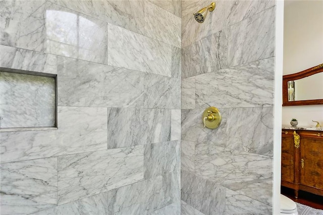 bathroom with a tile shower