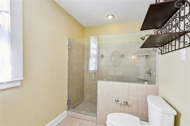 bathroom featuring tile patterned floors, toilet, and an enclosed shower