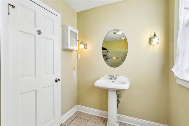 bathroom with tile patterned flooring