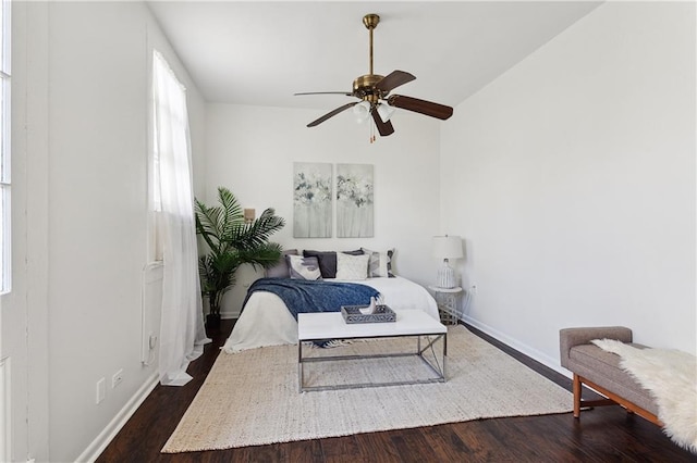 bedroom with multiple windows, ceiling fan, and dark hardwood / wood-style floors