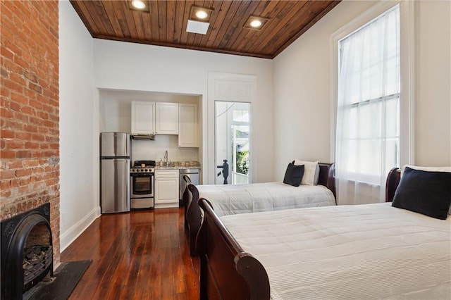 bedroom featuring dark hardwood / wood-style flooring, stainless steel refrigerator, and wooden ceiling