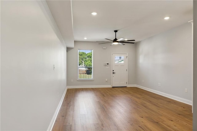 foyer entrance with ceiling fan and hardwood / wood-style floors