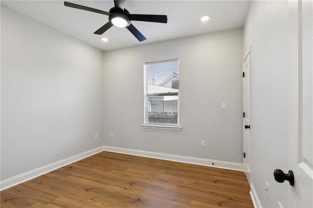 empty room featuring ceiling fan and hardwood / wood-style flooring