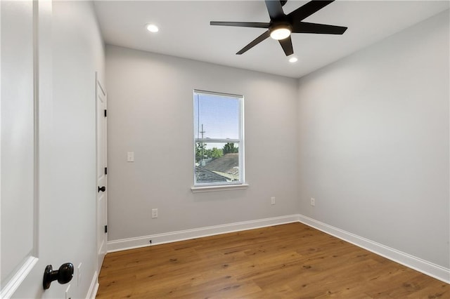 spare room featuring ceiling fan and hardwood / wood-style flooring