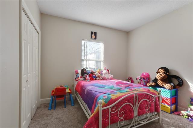 carpeted bedroom featuring a closet