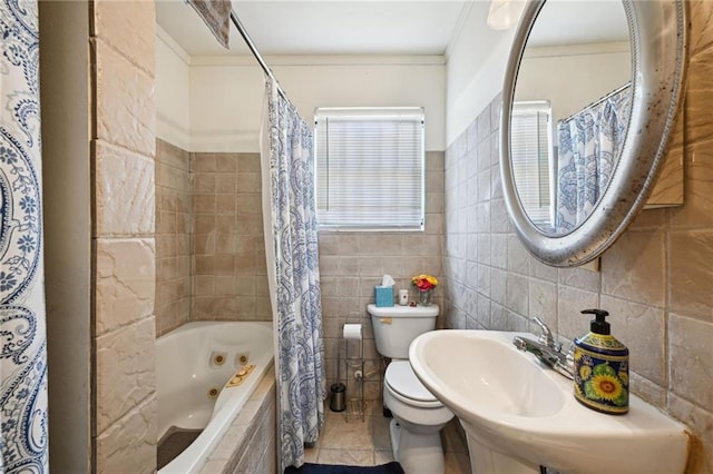 bathroom featuring tile walls, shower / bath combination with curtain, tile patterned floors, ornamental molding, and toilet