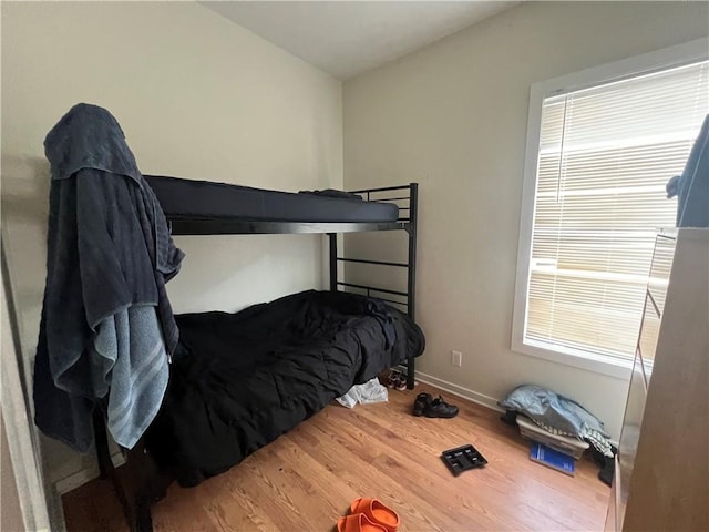 bedroom with wood-type flooring