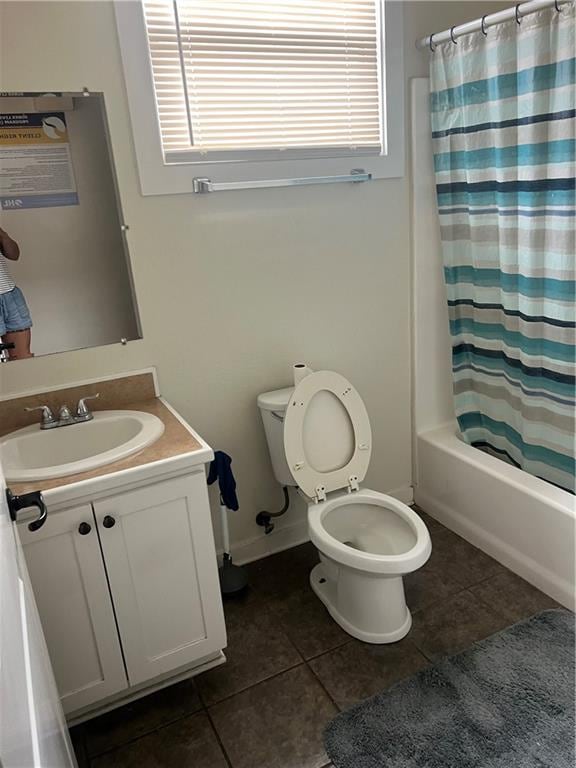 full bathroom with tile patterned flooring, shower / bath combo, vanity, and toilet