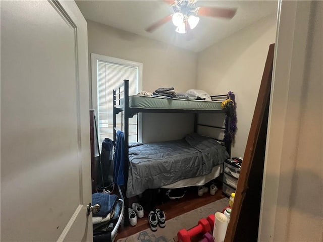 bedroom with ceiling fan and hardwood / wood-style floors