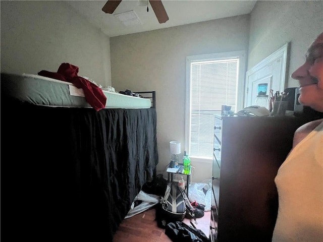 bedroom with lofted ceiling, wood-type flooring, and ceiling fan