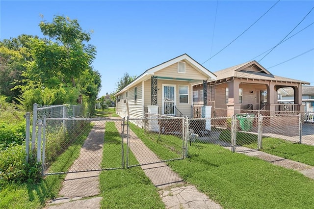 bungalow-style home featuring a front lawn