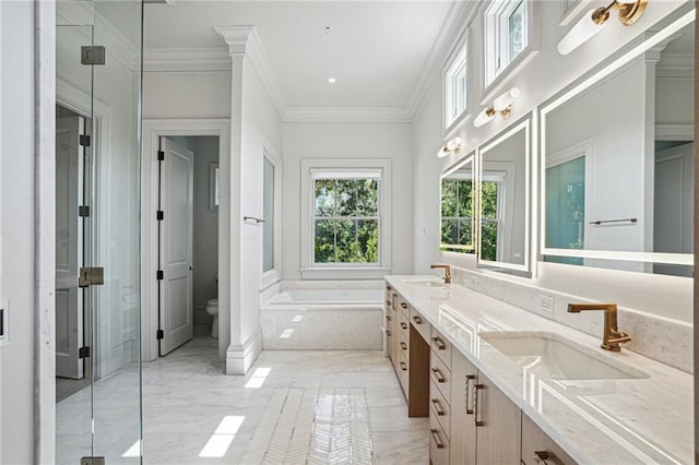 bathroom featuring ornamental molding, a relaxing tiled tub, vanity, and toilet