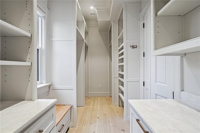 walk in closet featuring light hardwood / wood-style floors