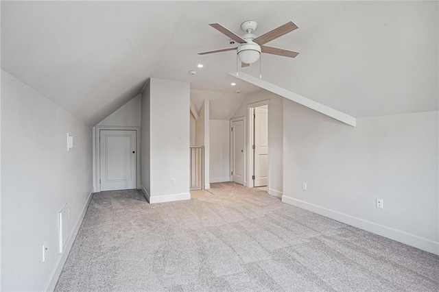 bonus room with light carpet, visible vents, baseboards, a ceiling fan, and vaulted ceiling