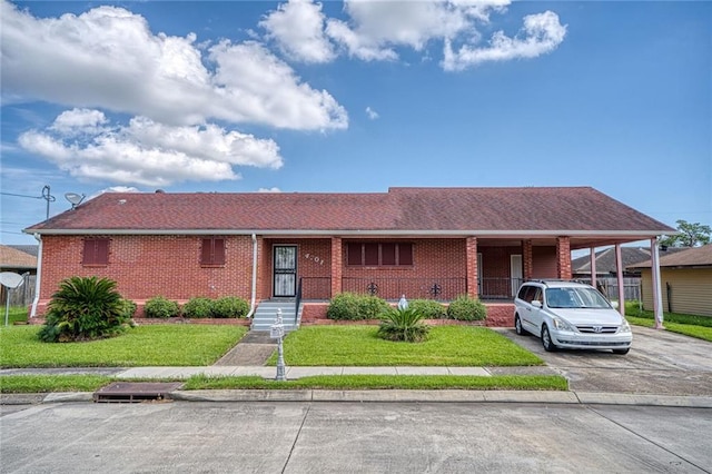 ranch-style house with a front lawn and a carport