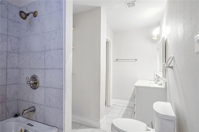 full bathroom featuring vanity, tiled shower / bath combo, toilet, and tile patterned floors