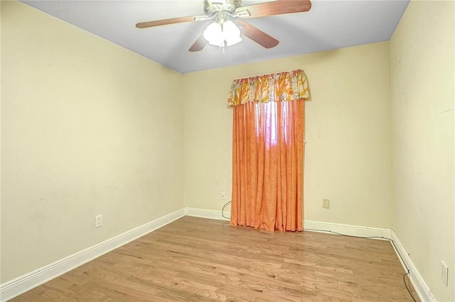 spare room with light hardwood / wood-style floors and ceiling fan