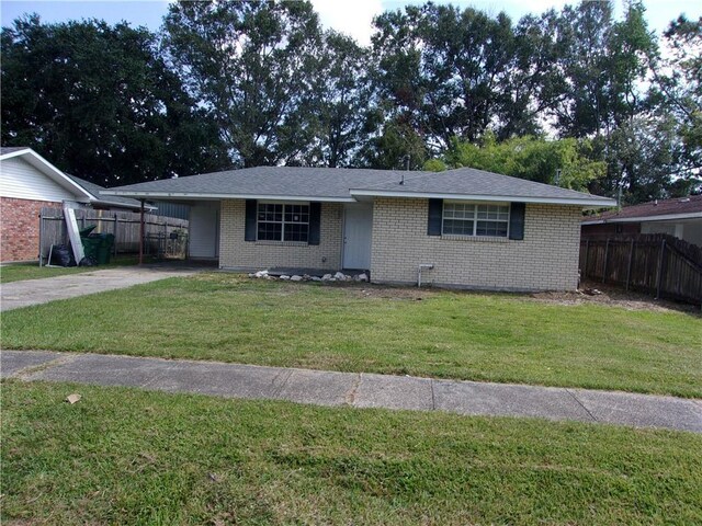 ranch-style house with a front lawn