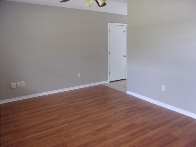 empty room featuring hardwood / wood-style flooring and ceiling fan