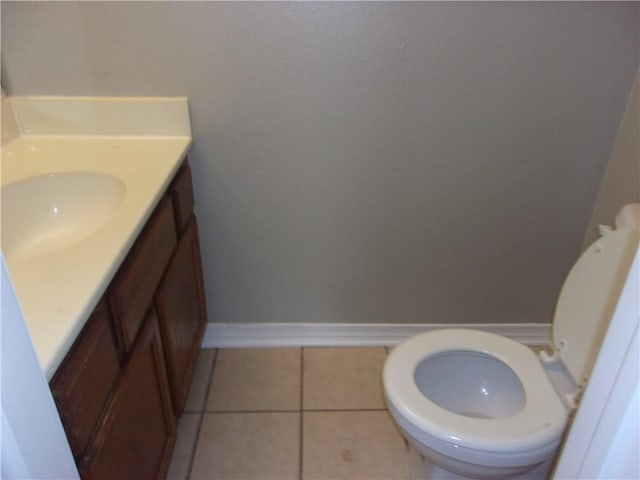 bathroom featuring vanity, toilet, and tile patterned floors