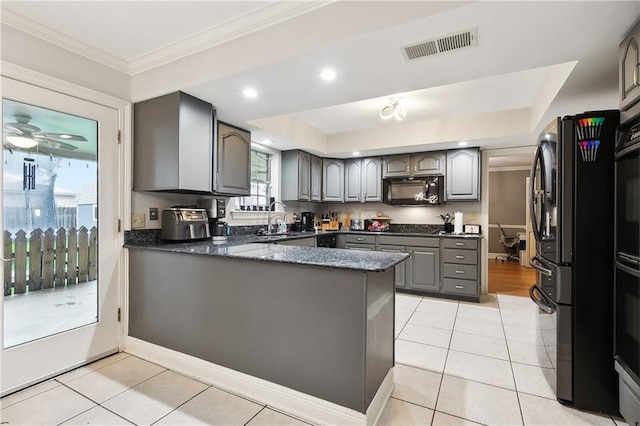 kitchen featuring black appliances, gray cabinetry, sink, kitchen peninsula, and light tile patterned floors