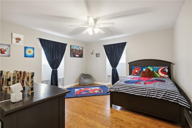 bedroom featuring wood-type flooring and ceiling fan