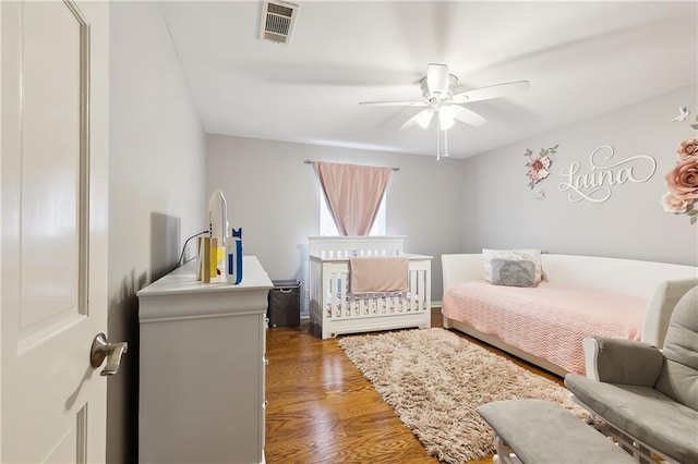 bedroom featuring ceiling fan and wood-type flooring