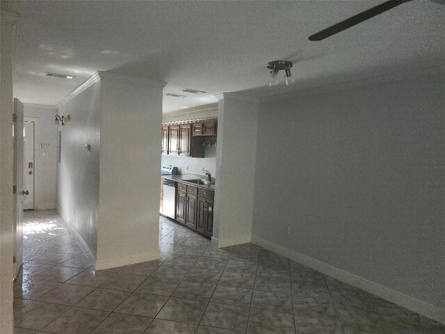 336 Indian Village Rd Unit 7, Slidell, LA 70461 - spare room with crown molding, baseboards, tile patterned flooring, and a sink