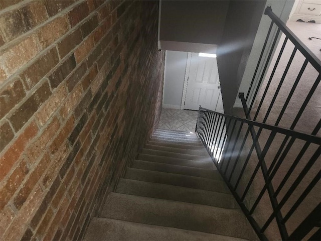 336 Indian Village Rd Unit 7, Slidell, LA 70461 - stairs featuring brick wall and baseboards