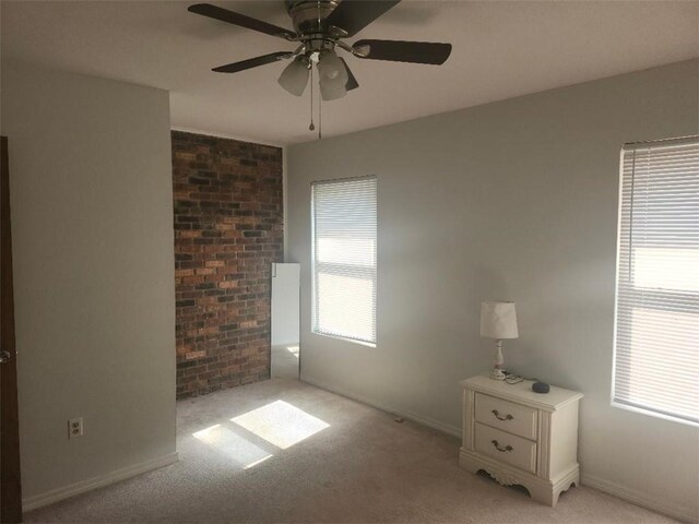 336 Indian Village Rd Unit 7, Slidell, LA 70461 - unfurnished bedroom with light colored carpet, baseboards, and a ceiling fan