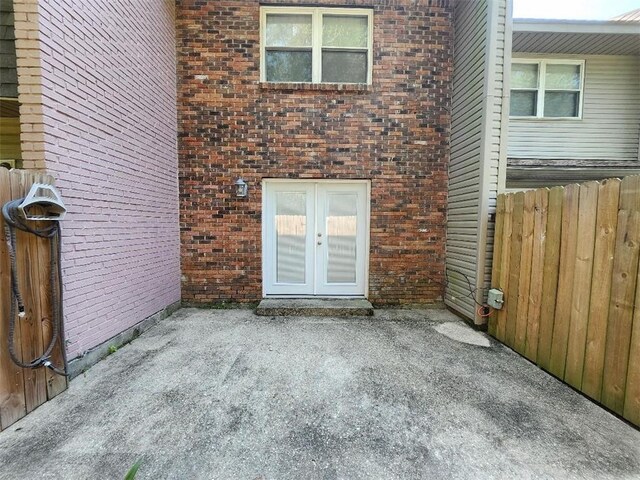 336 Indian Village Rd Unit 7, Slidell, LA 70461 - rear view of house with french doors, brick siding, and a patio