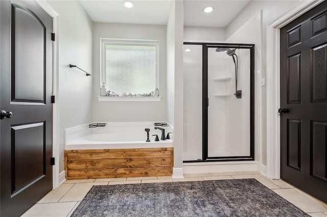 bathroom with plus walk in shower and tile patterned floors