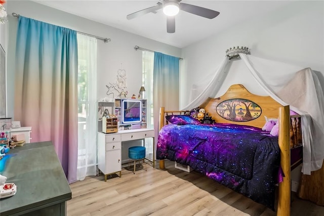 bedroom featuring ceiling fan and light hardwood / wood-style flooring