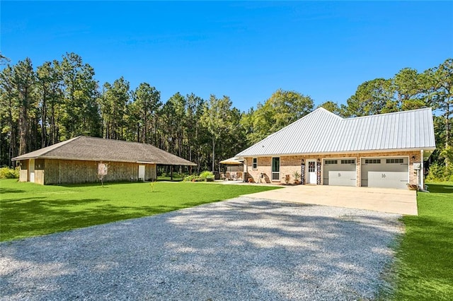 view of front facade with a front yard and a garage