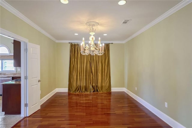 unfurnished dining area with an inviting chandelier, crown molding, and dark hardwood / wood-style flooring