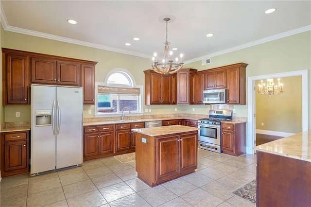 kitchen with ornamental molding, light tile patterned floors, decorative light fixtures, and stainless steel appliances