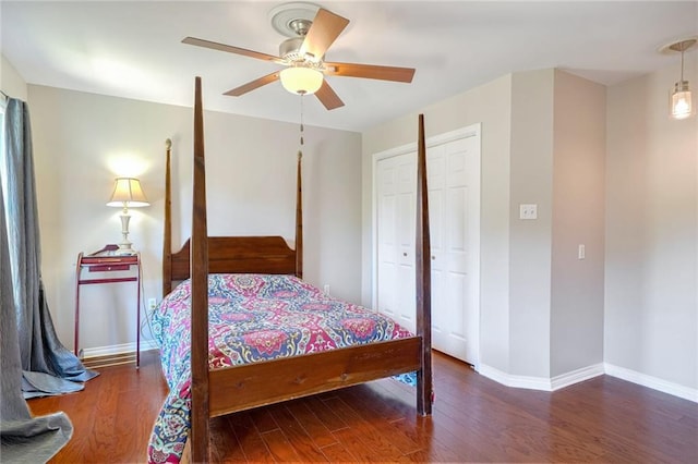 bedroom featuring ceiling fan, a closet, and dark hardwood / wood-style floors