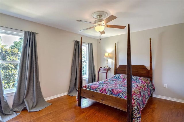 bedroom featuring hardwood / wood-style flooring and ceiling fan