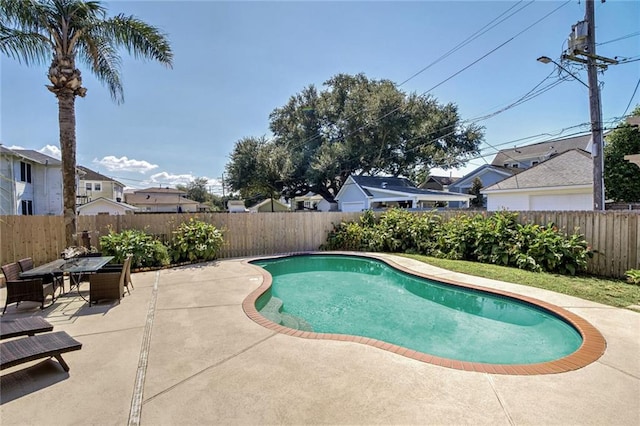 view of swimming pool featuring a patio area