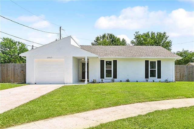 ranch-style house featuring a garage and a front lawn