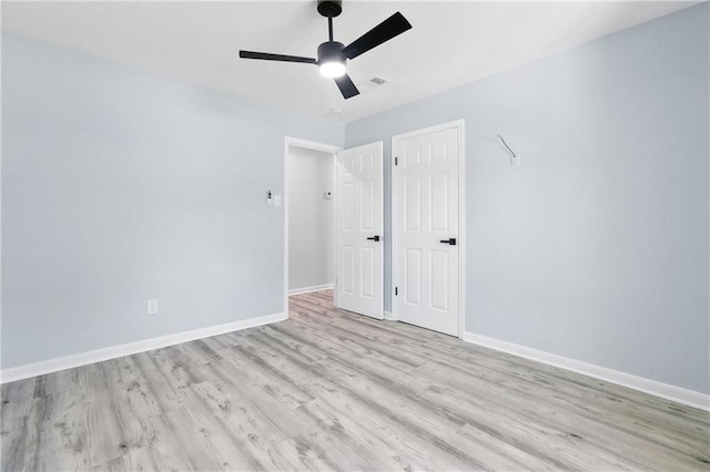 unfurnished bedroom with light hardwood / wood-style flooring and ceiling fan